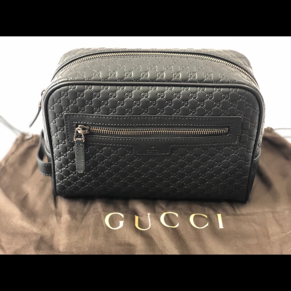 Gucci's GG embossed leather wash bag black